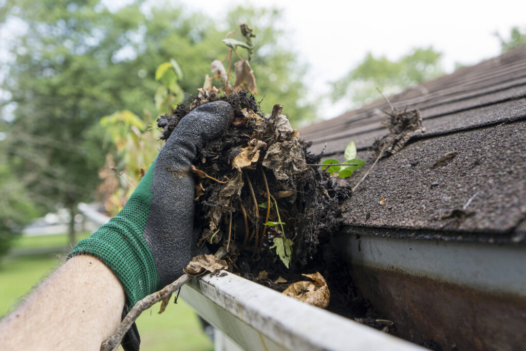 gutter being cleared by hand in Bromley